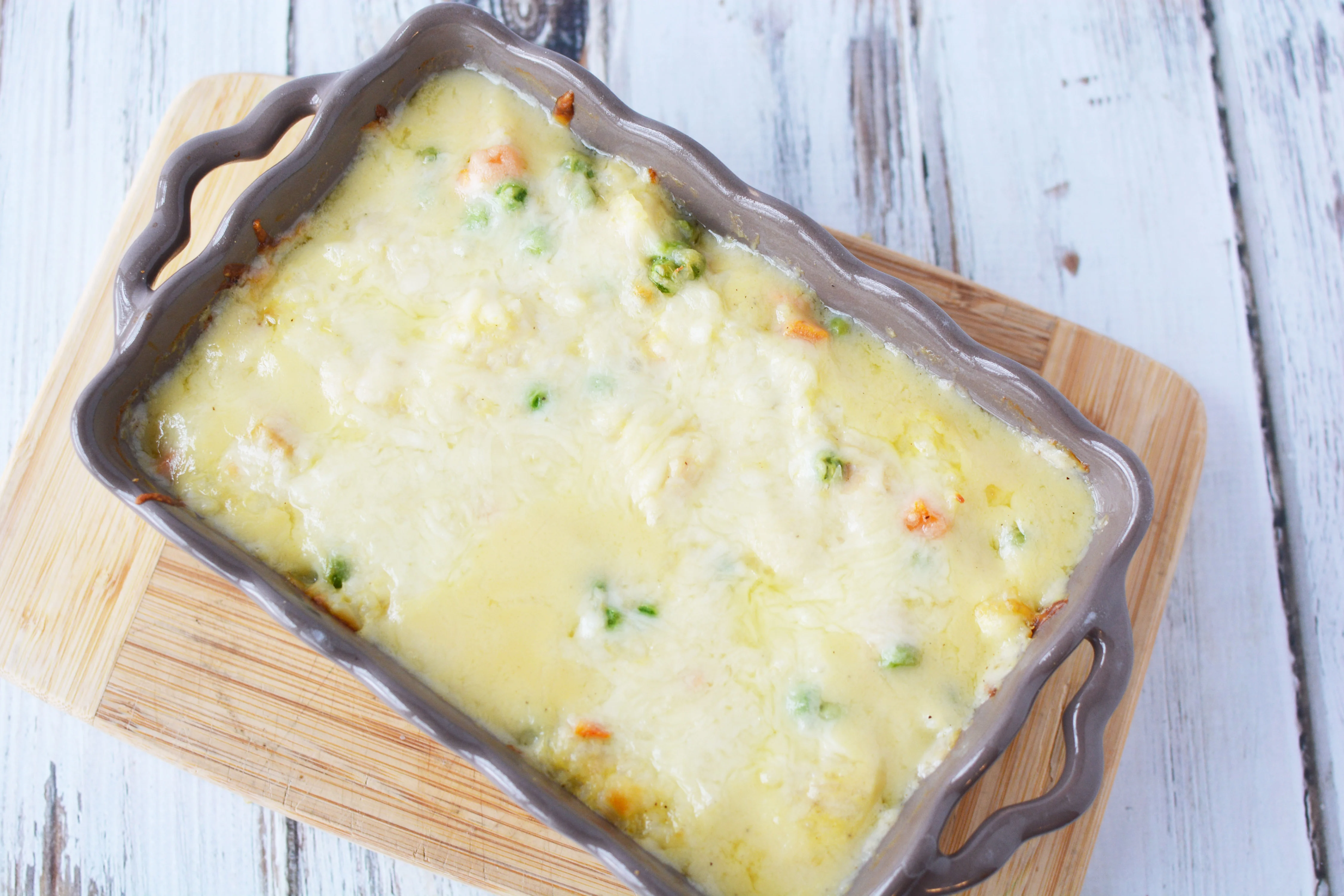 The melted cheese on top of the Chicken and Rice Casserole adds a depth of flavor.