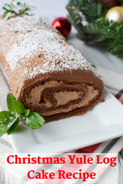 This Christmas dessert is a showstopper! It's chocolate cake filled with a sweet buttercream mocha frosting. This is a simple version of the traditional Yule log Cake recipe. #YuleLog #Dessert #ChristmasDessert #HolidayBaking #ChristmasCake #Holiday