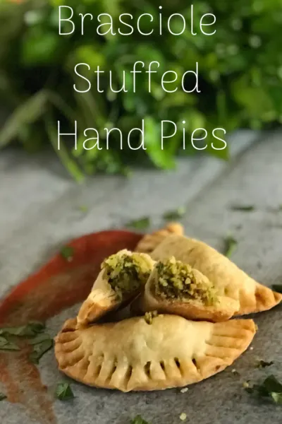 These brasciole stuffed hand pies are an easy Italian appetizer recipe. The stuffing is both sweet and savory then wrapped in a flakey pie crust. Serve with marinara for dipping! #Appetizer #Italian #Pie #HandPies #MiniPie