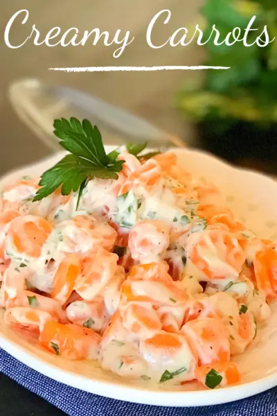 Creamy Carrots Side Dish: The perfect holiday side dish of fresh carrots in a creamy sauce. #Carrots #CarrotRecipe #SideDish #HolidayVegetables #Easter #EasterRecipe #EasterSideDish #ThanksgivingSideDish