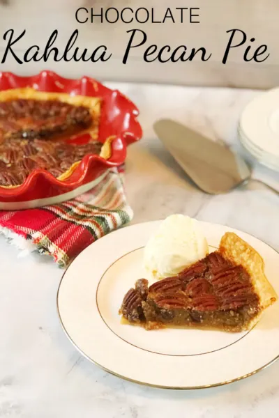 Kahlua Pecan Pie Recipe: This twist on the classic southern dessert includes a sweet boozy touch. Perfect for a Thanksgiving or Christmas dessert, it's a rich pie that people love! #PecanPie #PecanPieRecipe #Kahlua #BoozyPieRecipe #ChristmasDessert #ThanksgivingDessert #ThanksgivingRecipe
