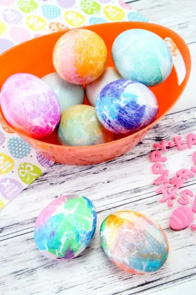 Tissue Paper Dyed Easter Eggs: If you want an easy way to dye eggs, check out this tissue paper method! It's perfect for kids and doesn't require vinegar. #Easter #EasterEggDying #EasterEggs #Eastercrafts #EasterKidsCrafts