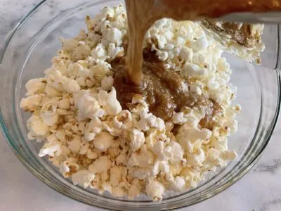 Pouring caramel over the popcorn