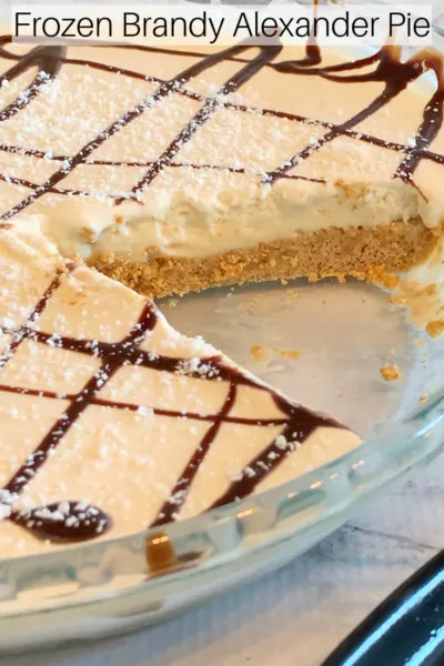 Frozen Brandy Alexander Pie: This easy pie recipe is creamy, boozy and delicious! Inspired by the classic cocktail, it's a refreshing summer dessert! #Pie #Dessert #FrozenDessert #SummerDessert #FrozenPie #BrandyAlexander #CocktailRecipe #BoozyPie