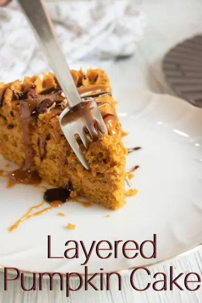 Bake this delicious layered pumpkin cake as a fall baking treat or Thanksgiving dessert. #ThanksgivingDessert #PumpkinCake #Thanksgiving #PumpkinDessert