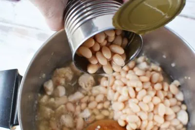 stirring in the great northern white beans
