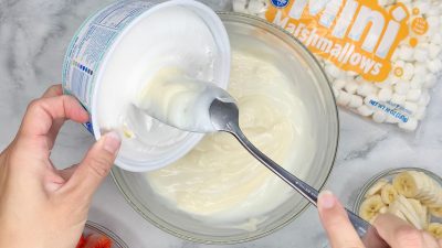 Fold in Cool Whip topping to the salad