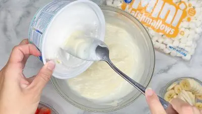 Fold in Cool Whip topping to the salad