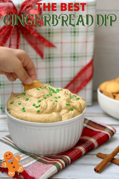 This Gingerbread Dip is the BEST holiday snack! Made with whipped cream, cream cheese, molasses and spices, it's easy to make. Serve at a holiday party, for dessert or with festive holiday cocktails. #Christmas #ChristmasSnack #HolidaySnack #ChristmasRecipe #Gingerbread #DessertDip