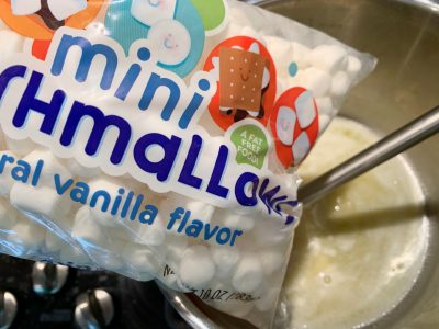 Adding mini marshmallows into the pot