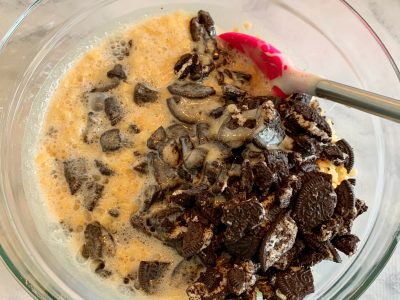 Mixing marshmallows together with the cereal