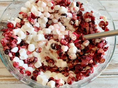 Folding marshmallows into the cranberry mixture 