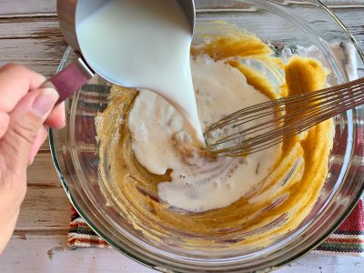 Adding Cream To Eggnog Pudding Mixture