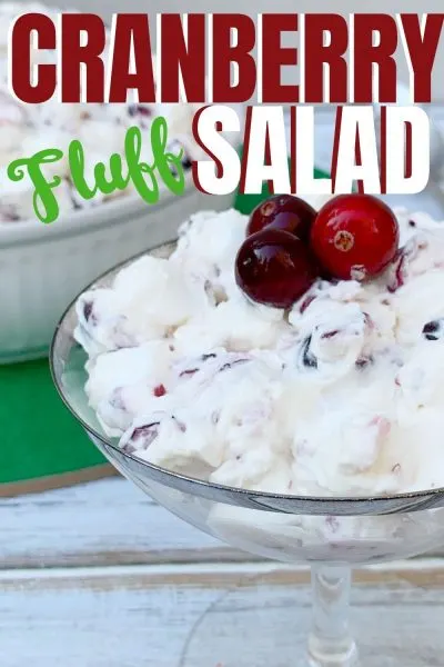 Need a Christmas Side Dish Recipe? This Cranberry Fluff Salad is a colorful addition! It's made with crushed pineapple, fresh cranberries and a dressing. It's everyone's favorite southern holiday recipe! #DessertSalad #CranberryFluffSalad #CranberrySalad #ChristmasSideDish #ChristmasRecipe #ChristmasSideDishRecipe