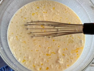 Whisking together baking mix, milk and eggs
