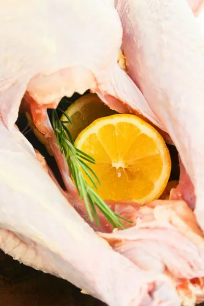 Stuffing the cavity of the whole turkey for flavor