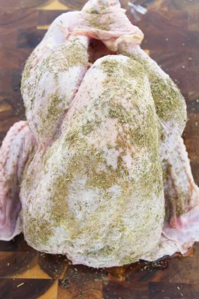 Adding poultry seasoning to the turkey before cooking