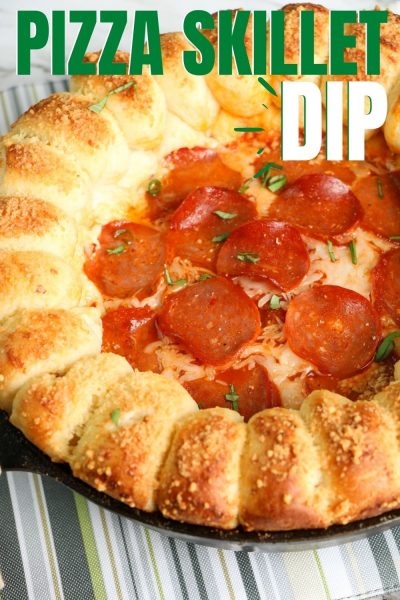 This is the BEST pizza dip recipe! It's baked to perfection, in a skillet, with a ring of bread for dipping. Just add your favorite toppings. #Dip #Appetizer #SuperBowlRecipe #SuperBowlAppetizer #GameDayFood #GameDayRecipes