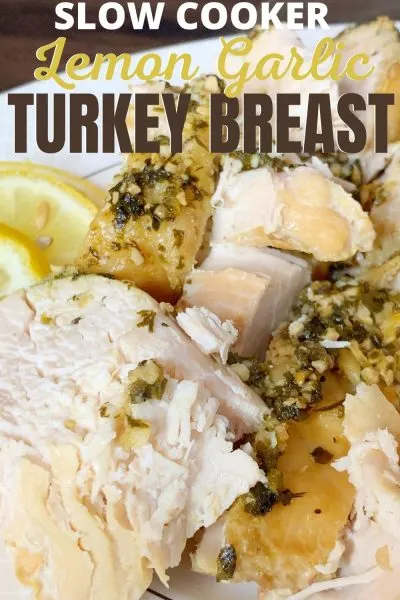 Flavored with minced garlic, fresh lemon and parsley, this slow cooker turkey breast recipe is always a Thanksgiving hit. #TurkeyBreast #Thanksgiving #ThanksgivingRecipe #ThanksgivingTurkey #SlowCooker #Turkey