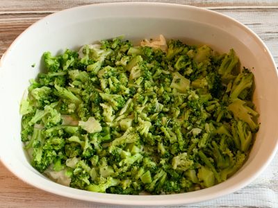 Layering potato broccoli casserole before baking