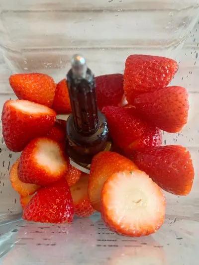 Blending strawberries in blender Blending strawberries in blender