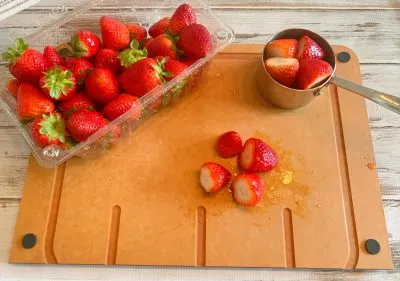 Washing strawberries and chopping Washing strawberries and chopping