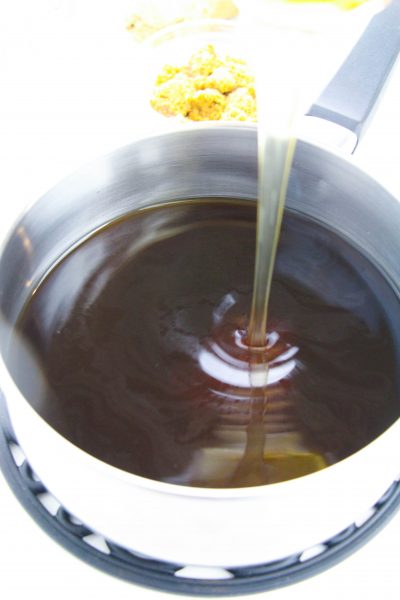 Whisking cornstarch mixture into sauce