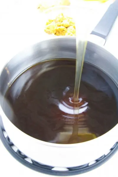 Whisking cornstarch mixture into sauce