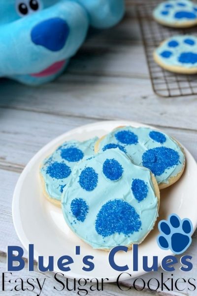 Throw a fun party with these EASY Blue's Clues cookies! They're a sugar cookie base with blue frosting and a sprinkle paw print to decorate. Perfect for a birthday party, snack or movie watching party! 