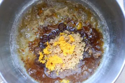 Stirring to make the orange citrus glaze