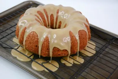 Pouring Glaze Topping Over Bundt Cake