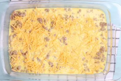 Topping Tater Tot Casserole with cheese