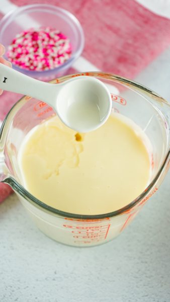 Adding extract to the buttercream frosting