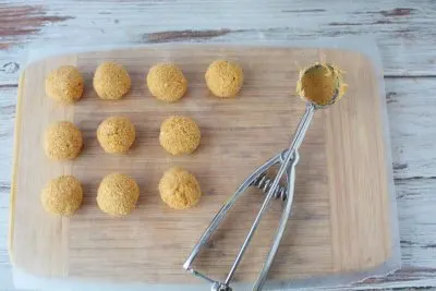 Scooping truffles onto parchment paper