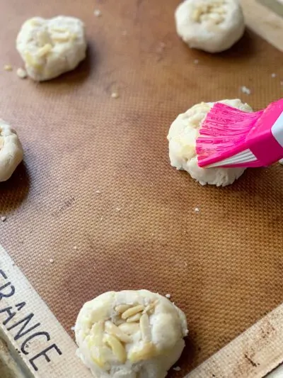 Brushing cookies with pastry brush