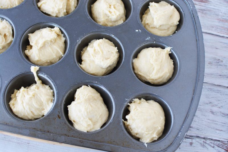 Adding the dough to muffin tin
