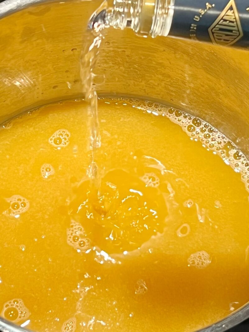 Adding Everclear to make peach moonshine
