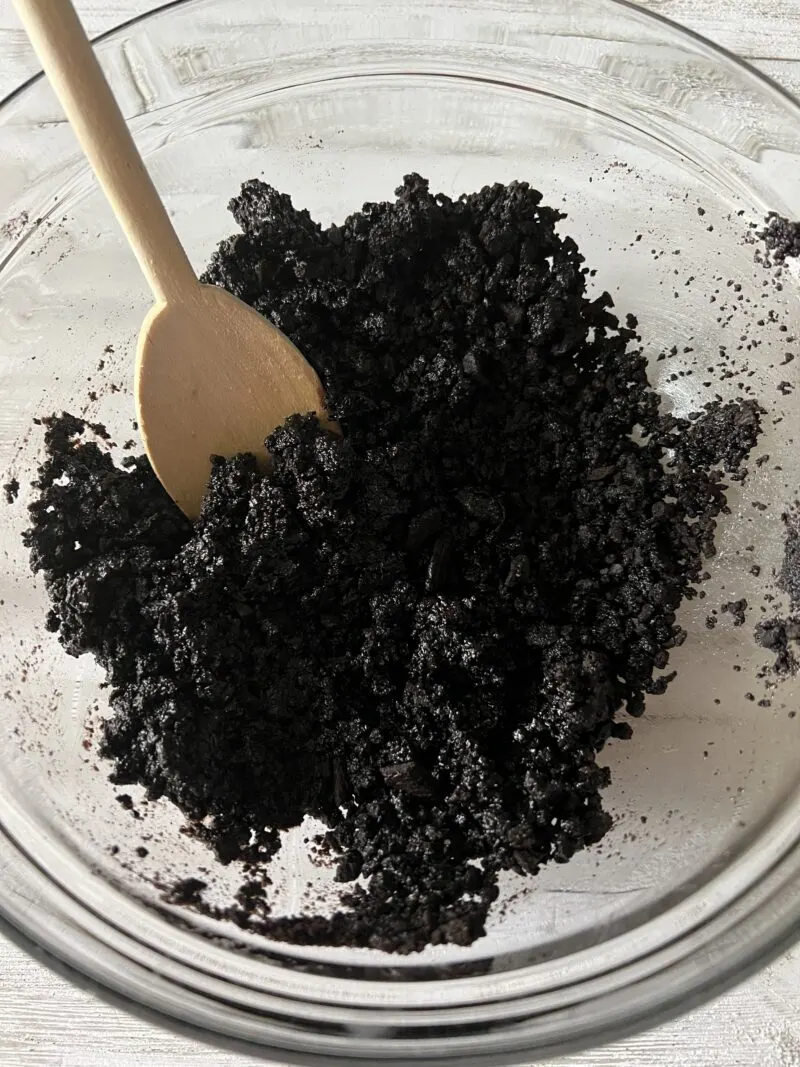 Mixing cookie crumbles with sugar and egg white