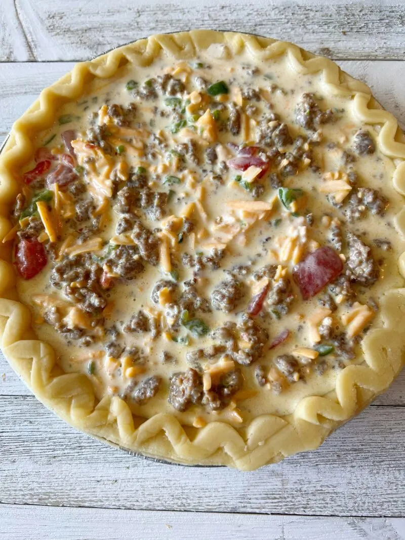 Unbaked quiche in pastry shell