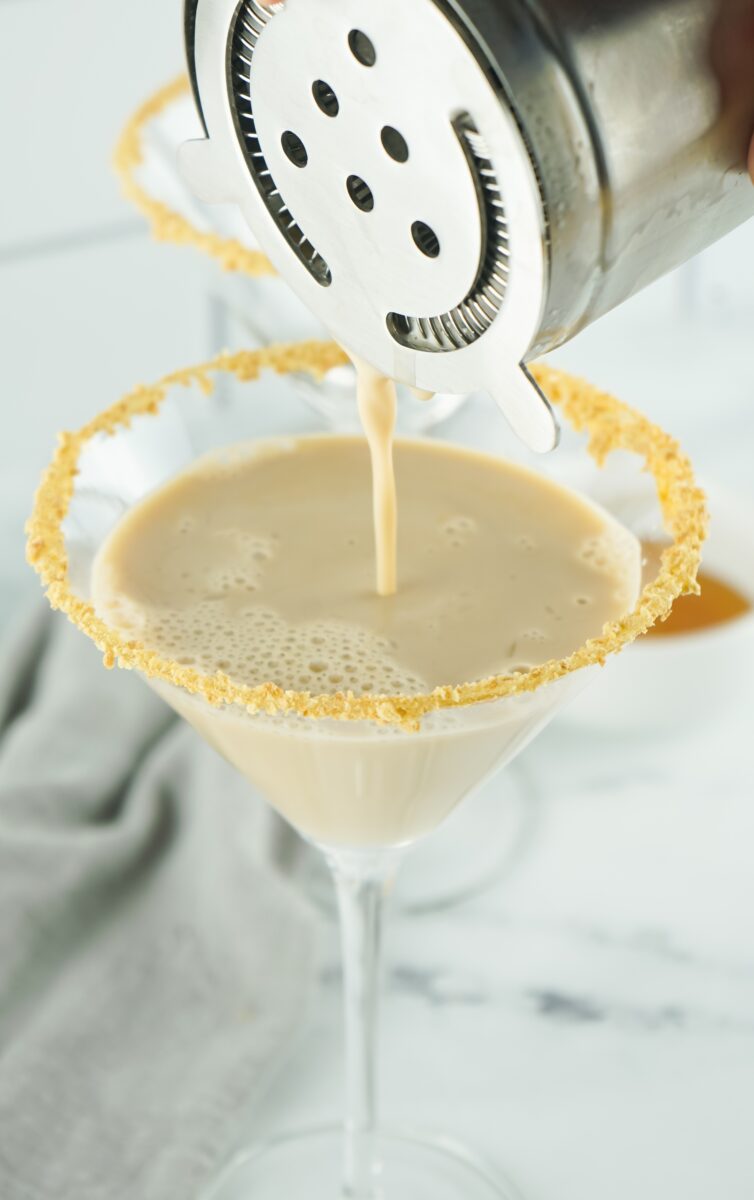 Pouring Gingerbread Martinis into glass