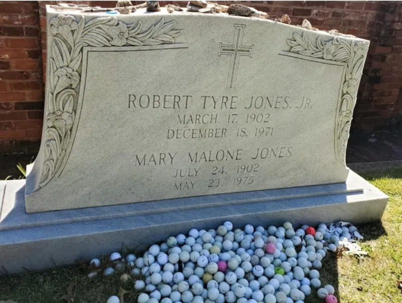 Golf balls on Bobby Jones grave site