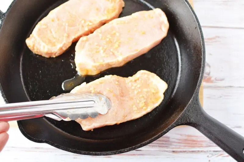 Searing pork chops on hot pan
