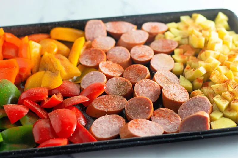 How to line up your sausage and veggies on the pan.