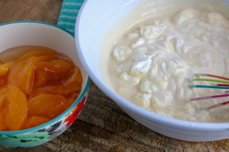 Making the fresh whipped cream with electric hand mixer