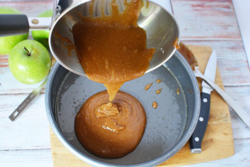 Pouring caramel into bottom of baking pan