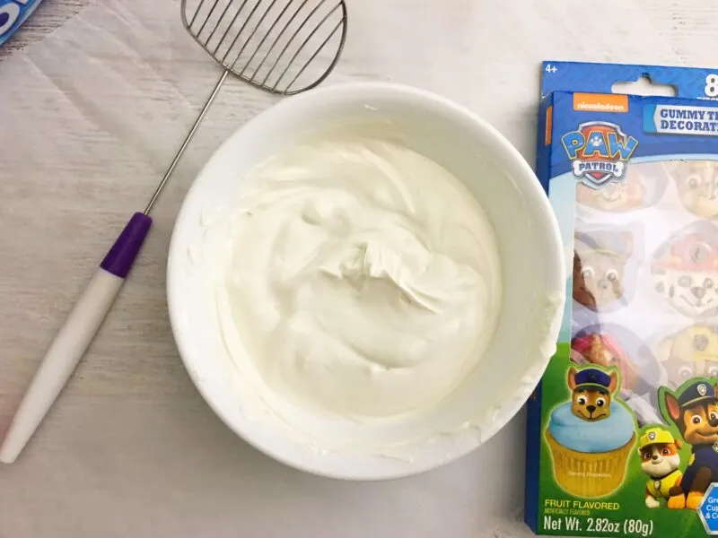 Using the slotted spoon to dip cookies