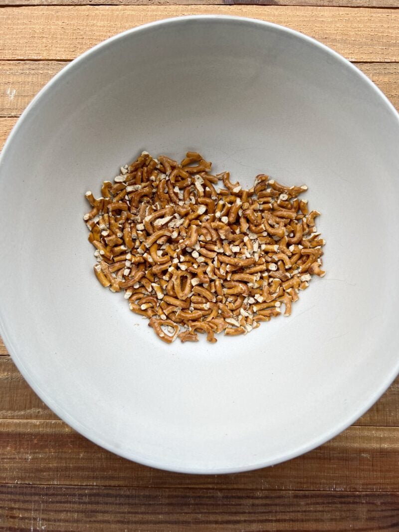 Crushed pretzels in medium bowl