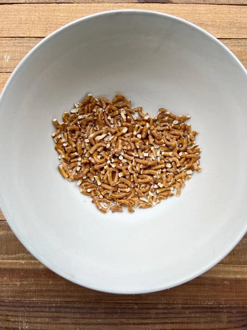 Crushed pretzels in medium bowl