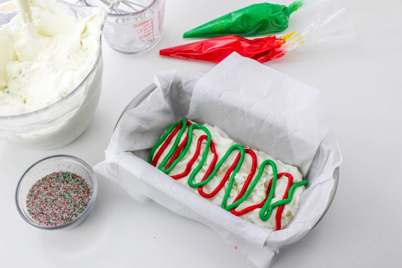 Pipe half of the frosting into the ice cream.