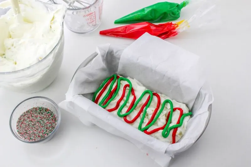 Pipe half of the frosting into the ice cream.